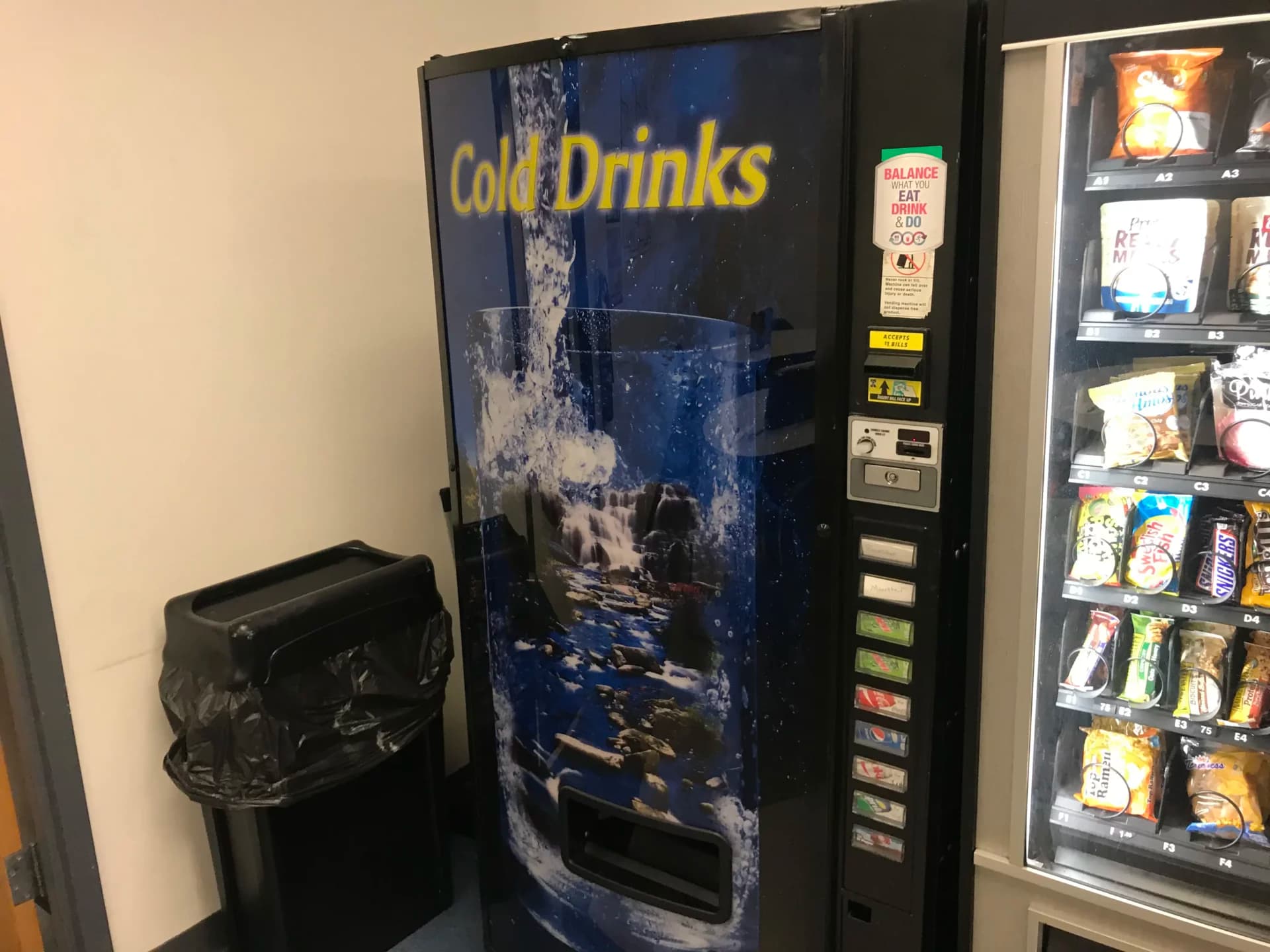 Beverage and snack vending machines installed side by side